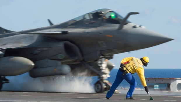 A French fighter jet taking off from the deck of France's aircraft carrier Charles de Gaulle, at the start of France's bombing of Islamic State in Mosul and Ramadi in November.