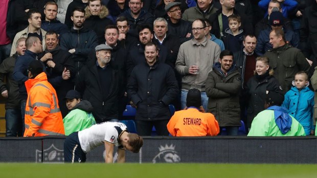 Tottenham's Harry Kane kneels injured on the turf at White Hart Lane.