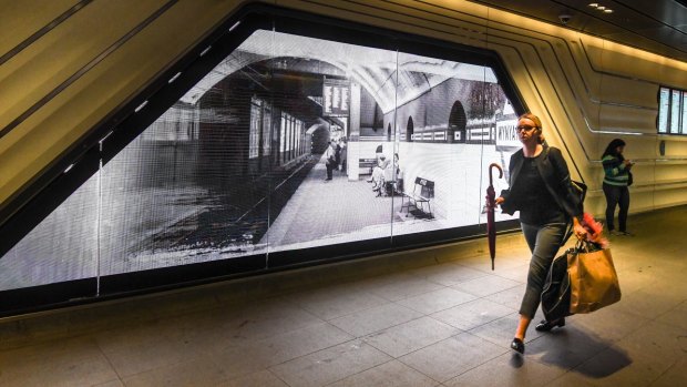 An electronic screen features archival photographs of Wynyard Station.