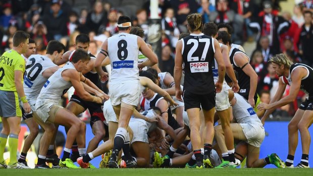 A melee erupts after St Kilda players sledged Marc Murphy