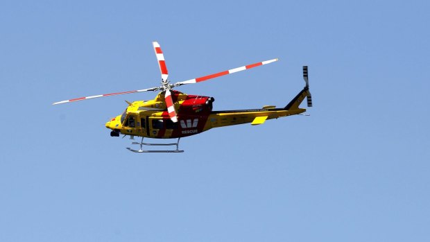 A Westpac helicopter on shark patrol during the Surfest's Indigenous Classic.