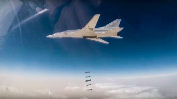 A Russian Tu-22M bomber unloads bombs on IS targets near Abu-Kamal, Syria. 