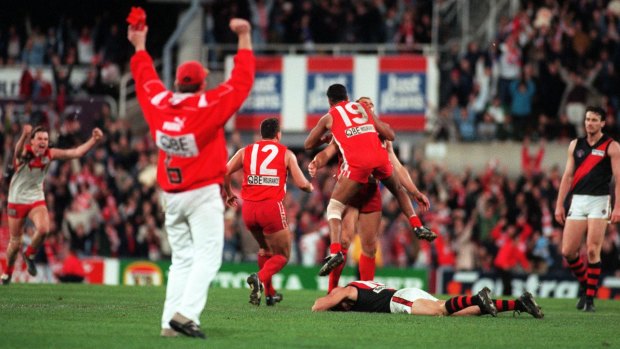 Sydney Swans players congratulate Tony Lockett after he kicked a behind to put them through to the grand final. Photo taken 21 September 1996.