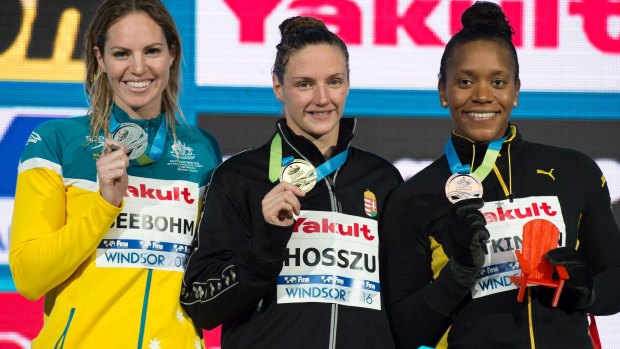 Podium: Silver medalist Emily Seebohm of Australia alongside Katinka Hosszu of Hungary and Alia Atkinson of Jamaica after the women's 100-meter individual medley.