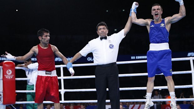 Disbelief: Muhammad Waseem (L) reacts after Australia's Andrew Maloney is awarded the gold medal.