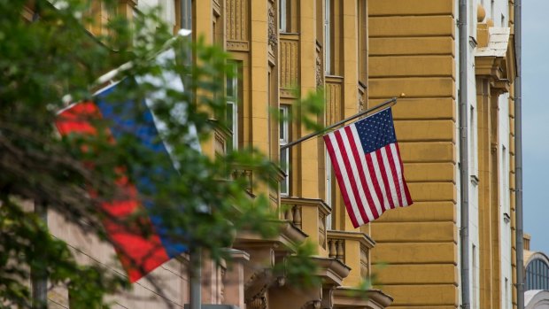 US and Russian flags hung at the US Embassy in Moscow, Russia.