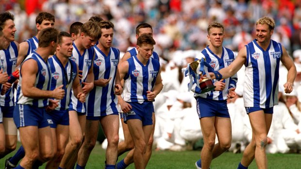 Brent Harvey (centre) in 1996, the year Caleb Marchbank was born.
