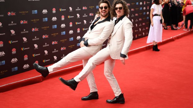 Peking Duk opted for a John Travolta-esque vibe on the carpet for the ARIA awards in 2017.