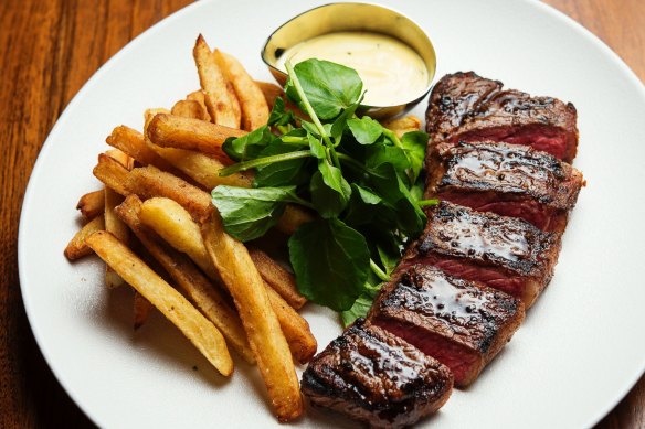 Steak frites with triple-cooked chips, watercress, and bearnaise.