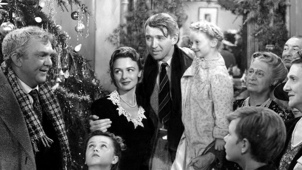 Thomas Mitchell, left, Donna Reed and James Stewart, centre, in a scene from  <i>It's A Wonderful Life</i>.