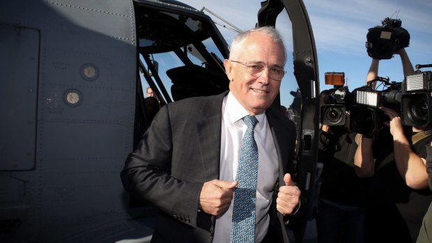 Prime Minister Malcolm Turnbull emerges from a Seahawk Romeo helicopter at HMAS Albatross near Nowra on Wednesday.