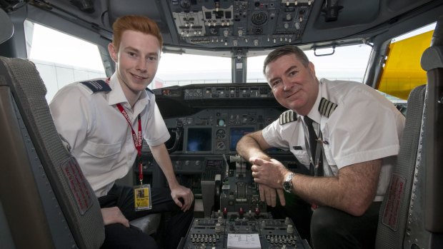 Hamish Douglass, left, with his father Brett, a Virgin pilot and post grad aviation student.