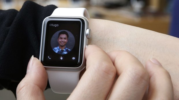 A customer tries on an Apple Watch.