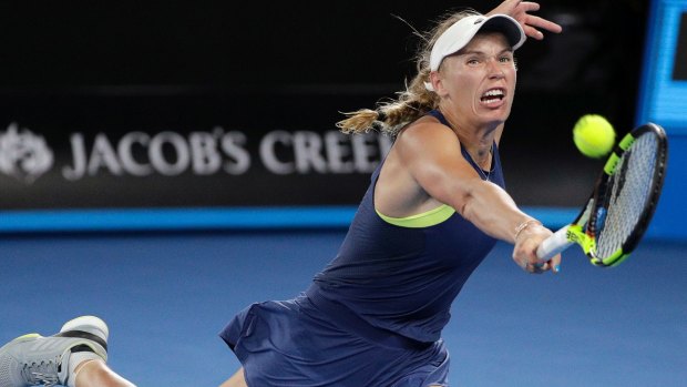 Wozniacki stretches for a backhand.