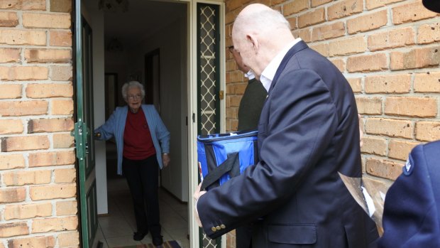 Meals on Wheels client Norma Steele was greeted by Governor-General Sir Peter Cosgrove who delivered her two meals and a bunch of flowers for her birthday.