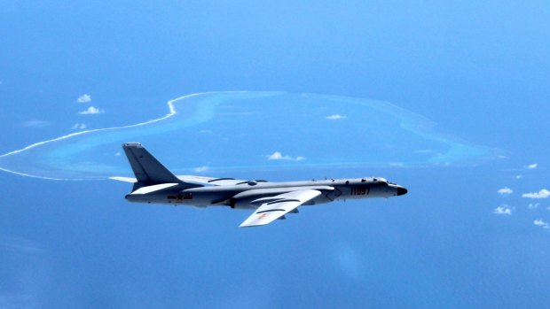 A Chinese H-6K bomber patrols the islands and reefs in the South China Sea. 
