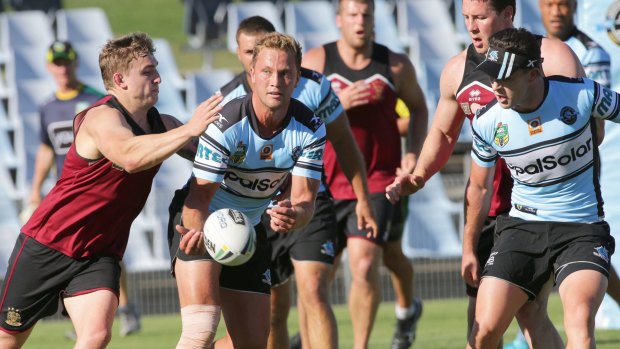 Warming up: Cronulla Sharks and Wigan Warriors scrimmage at training.