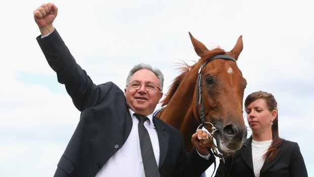 Happy man: Trainer Paul Beshara salutes Happy Trails' thrilling win in the Mackinnon Stakes. 