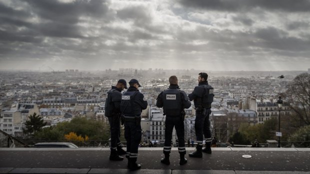 French police officers stand on guard near the church of Sacre Coeur in Paris. Sacks calls what happened in Paris altruistic evil, or acts of terror in which the self-sacrifice involved somehow is thought to confer the right to be merciless.