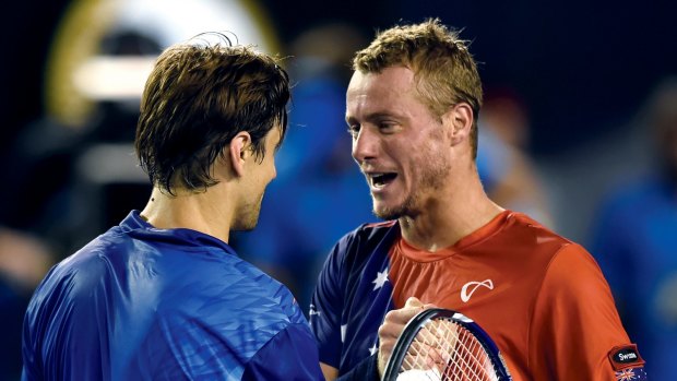 David Ferrer, left, is congratulated by Lleyton Hewitt after his swansong.