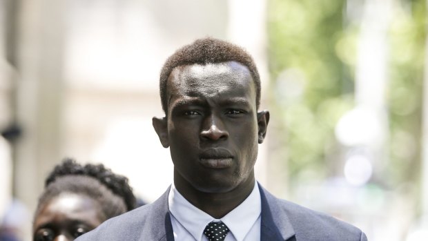North Melbourne player Majak Daw arrives at the County Court. He has pleaded not guilty to three counts of rape.