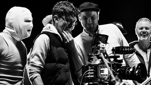 On set  ... Abe Forsythe (second from left) watches a take with actor Justin Rosniak, director of photography Lachlan Milne and stunt co-ordinator Tony Lynch.