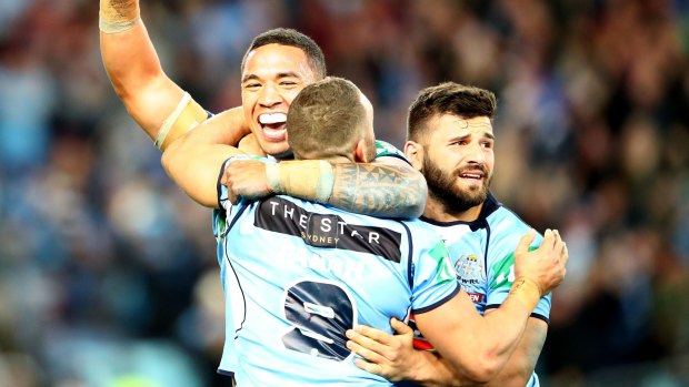 At last: The Blues celebrate winning game three of the State Of Origin series.