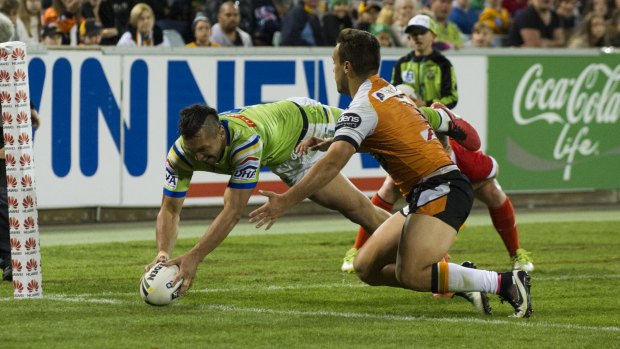 Jordan Rapana scores one of his four tries against the Wests Tigers.