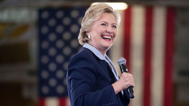 Hillary Clinton smiles as she arrives to speak at a rally at Goodyear Hall and Theater in Akron, Ohio on Monday. 