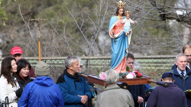 Anti-abortion protesters hold a vigil outside a Melbourne medical clinic.