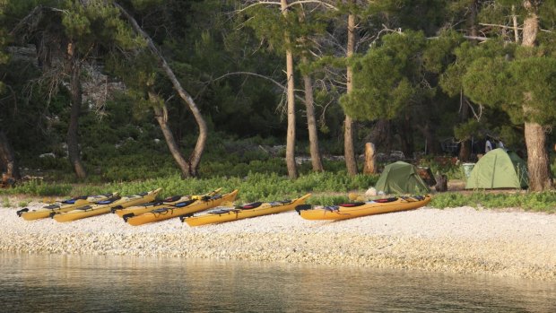 Kayaks and campsite on Prison Island.