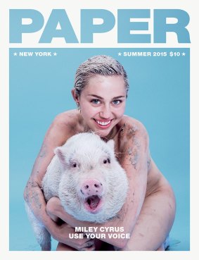 In the pink: Miley Cyrus with her pet pig, Bubba Sue, on the cover of <i>Paper</i>.