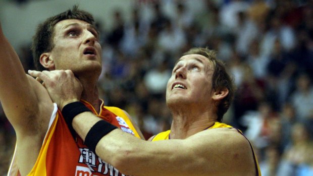 Back in the day: Sydney Kings coach Ben Knight battles with Melbourne Tigers great Chris Anstey in 2006.