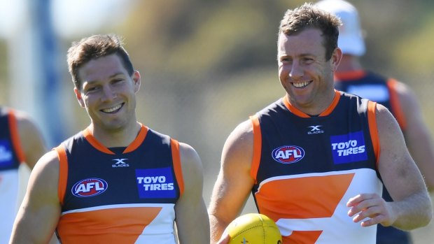 Determined: Steve Johnson enjoys a moment at training with Toby Greene.