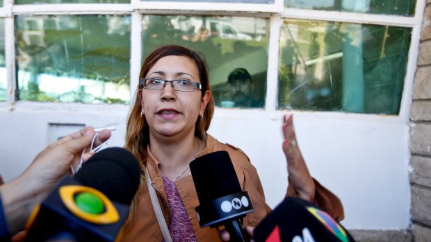 Itati Leguizamon, wife of submarine crew member German Suarez, speaks with the media.