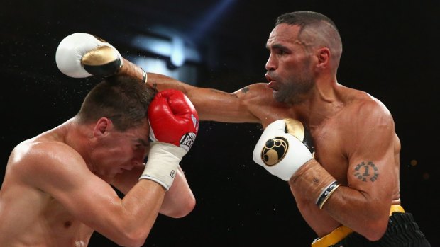 Dishing it out: Anthony Mundine on his way to victory over Sergey Rabchenko.