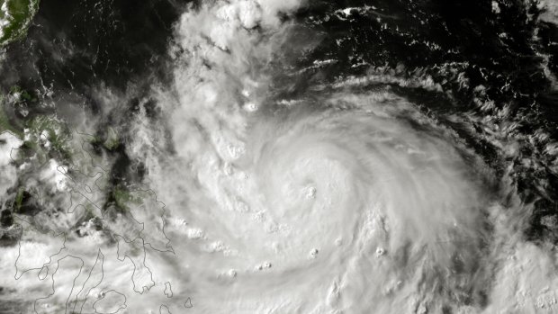 Stirred up: Satellite image of Typhoon Rammasun approaches the Philippines.