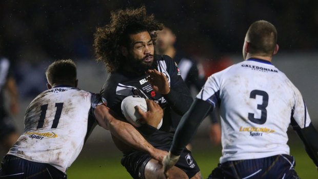 Hard man, soft target: Adam Blair takes on Scotland during the Four Nations.