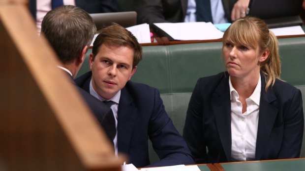 Opposition Leader Bill Shorten consults advisers Ryan Liddell and Kimberley Gardiner during question time last year. 