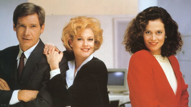 From left, Harrison Ford, Melanie Griffith  and Sigourney Weaver in the movie <i>Working Girl</i>.