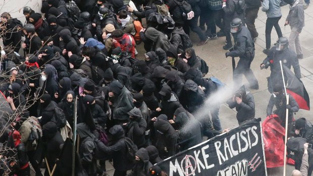 Police use pepper spray on protesters in Washington.