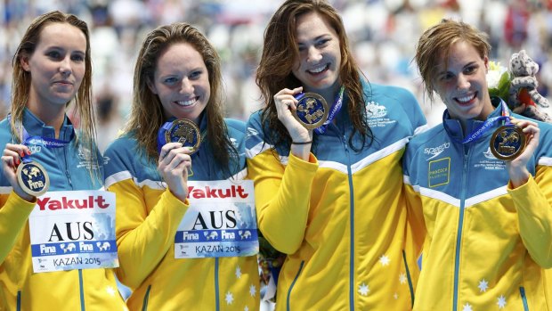 Gold medal winners: The Aussie relay team proudly display their medals. 