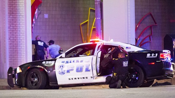 Dallas Police shield bystanders during a Black Live Matter rally in downtown Dallas.