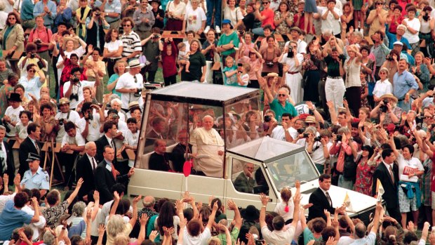 Pope John Paul II waves to the crowd on his way to preside over the Mass beatifying Mary MacKillop, Sydney,  January 19, 1995.