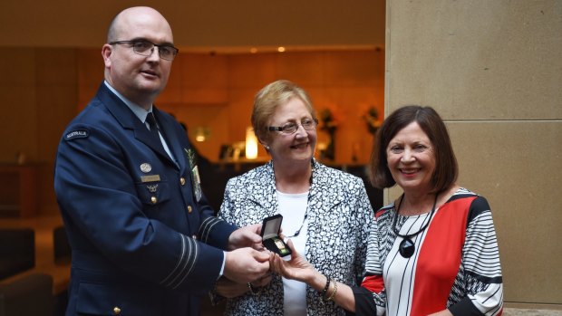 Wing-Commander Nathan Klos will present the watch to Rhonda Marchant (right).