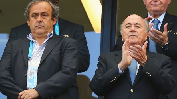 Platini (left) and Blatter during the 2014 FIFA World Cup.