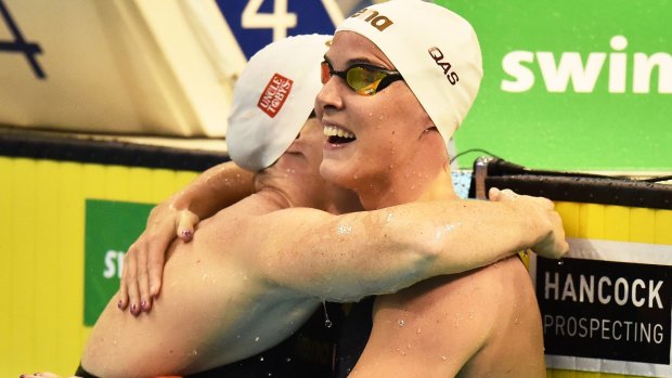 Sister act: Cate Campbell, left, and Bronte Campbell hug at the end of the race.