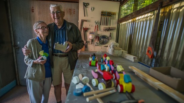 Kambah couple Beryl and John Fillery build and paint wooden toys to give away to children.
