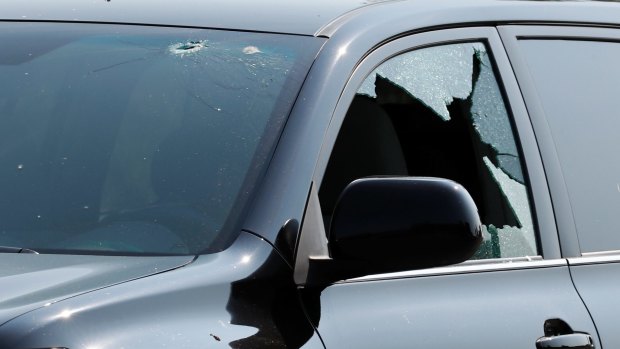 A vehicle at the scene in Alexandria is seen with bullet holes in it.