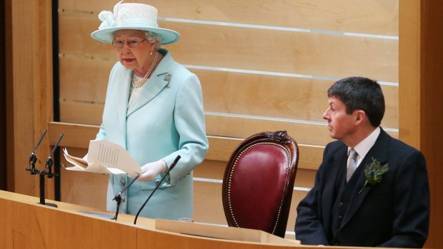 The Queen speaks during the opening of the fifth session of the Scottish Parliament as Ken Macintosh, Presiding Officer of the Scottish Parliament, looks on.